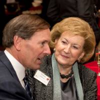 Helen DeVos sitting with her son, Dan DeVos.